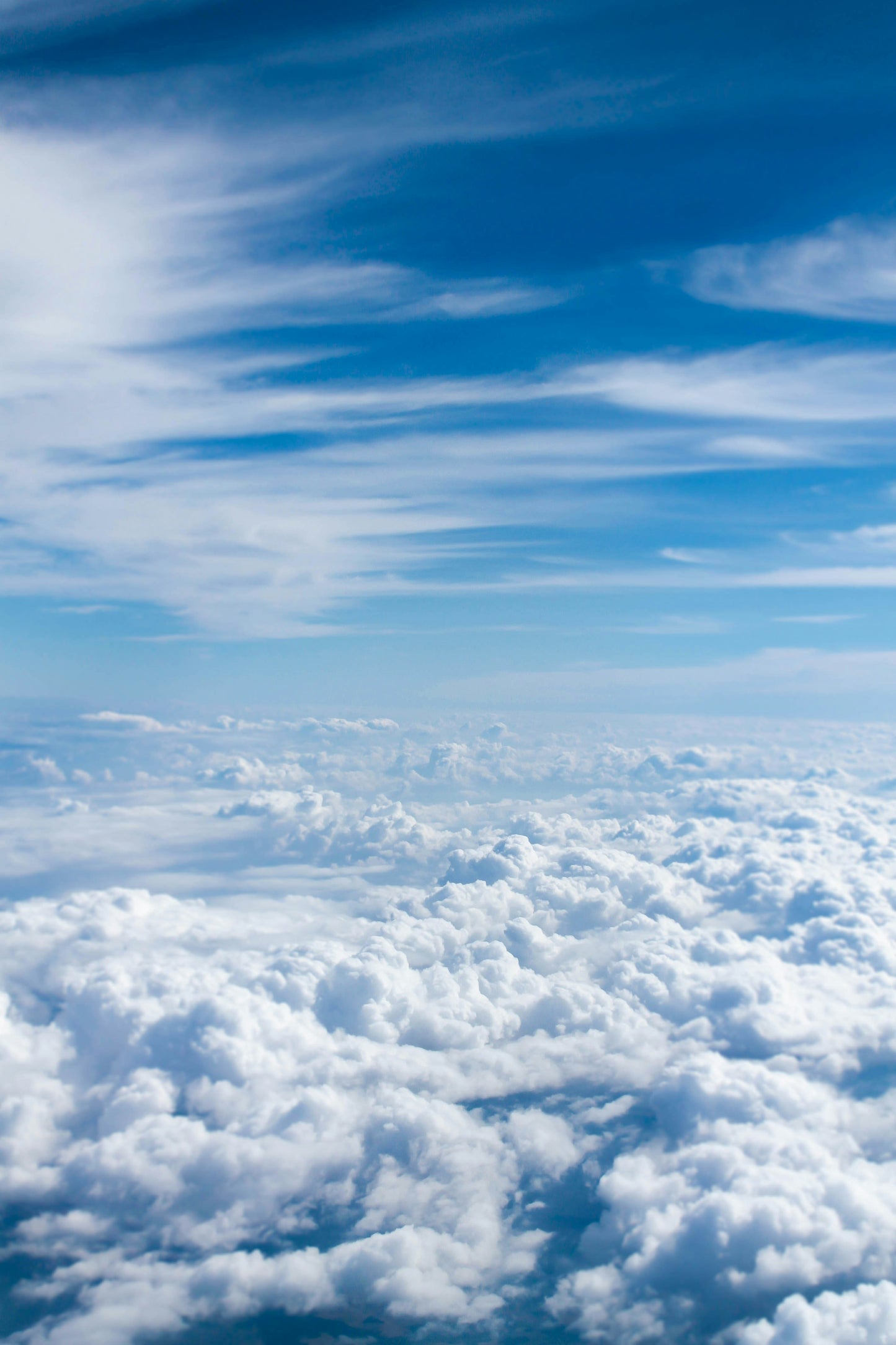 Stretched Canvas: above-cloud photo of blue skies – Taylor Van Riper (Unsplash)