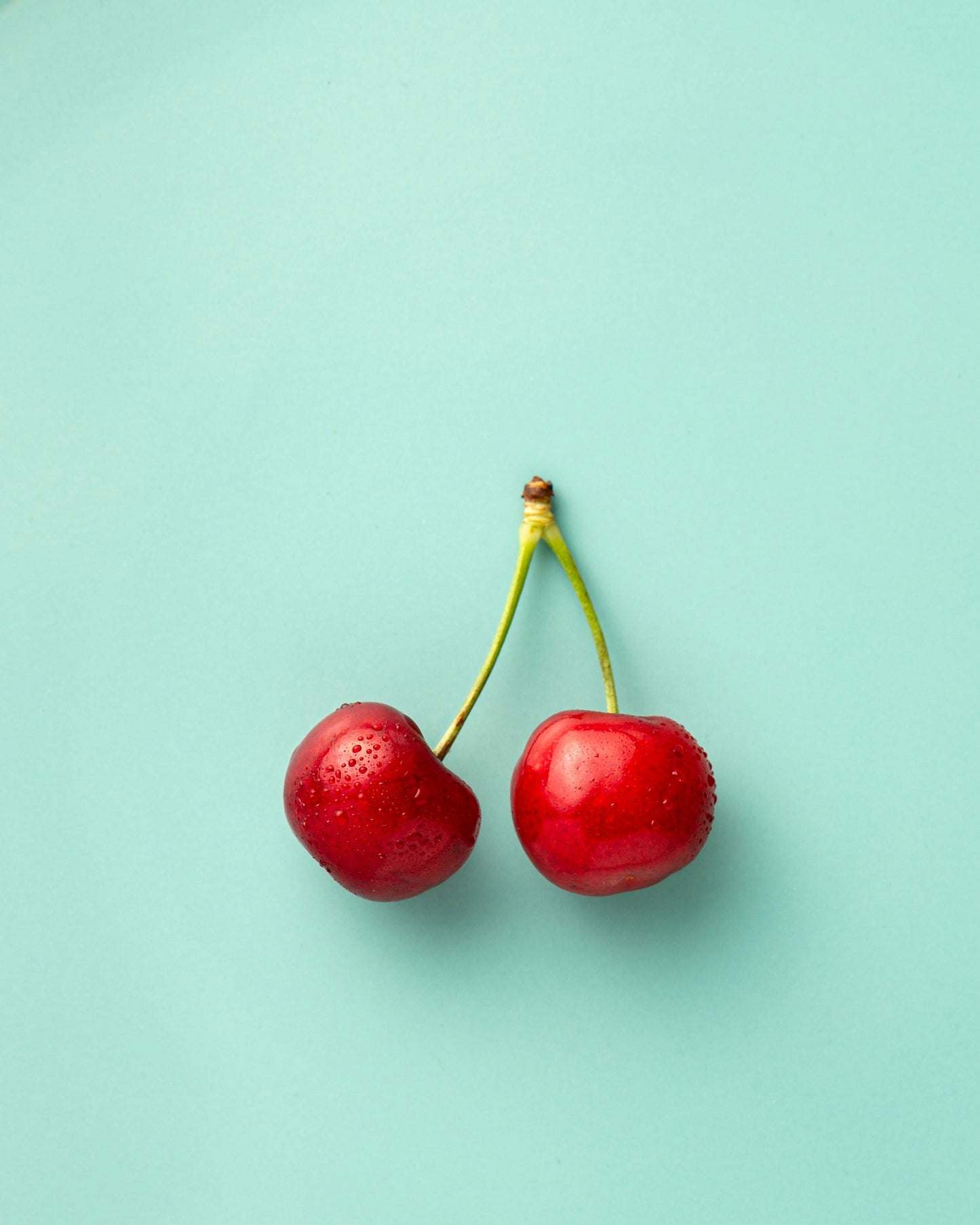 Poster: two cherries – Mae Mu (Unsplash)