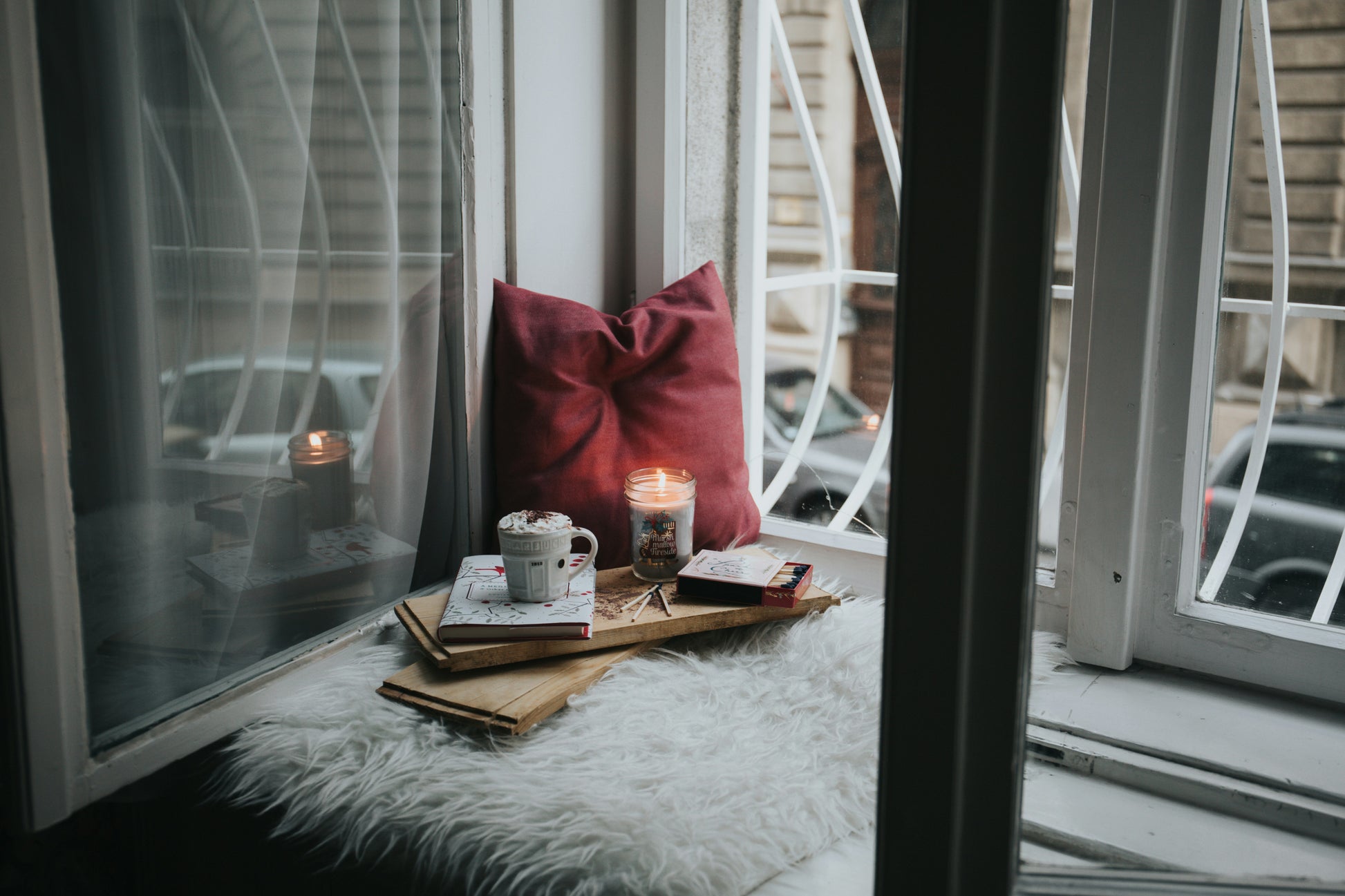 Stretched Canvas: photo of gel candle on board beside pillow – Alisa Anton (Unsplash)