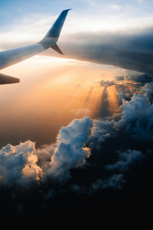 Stretched Canvas: airplane on sky during golden hour – Tom Barrett (Unsplash)
