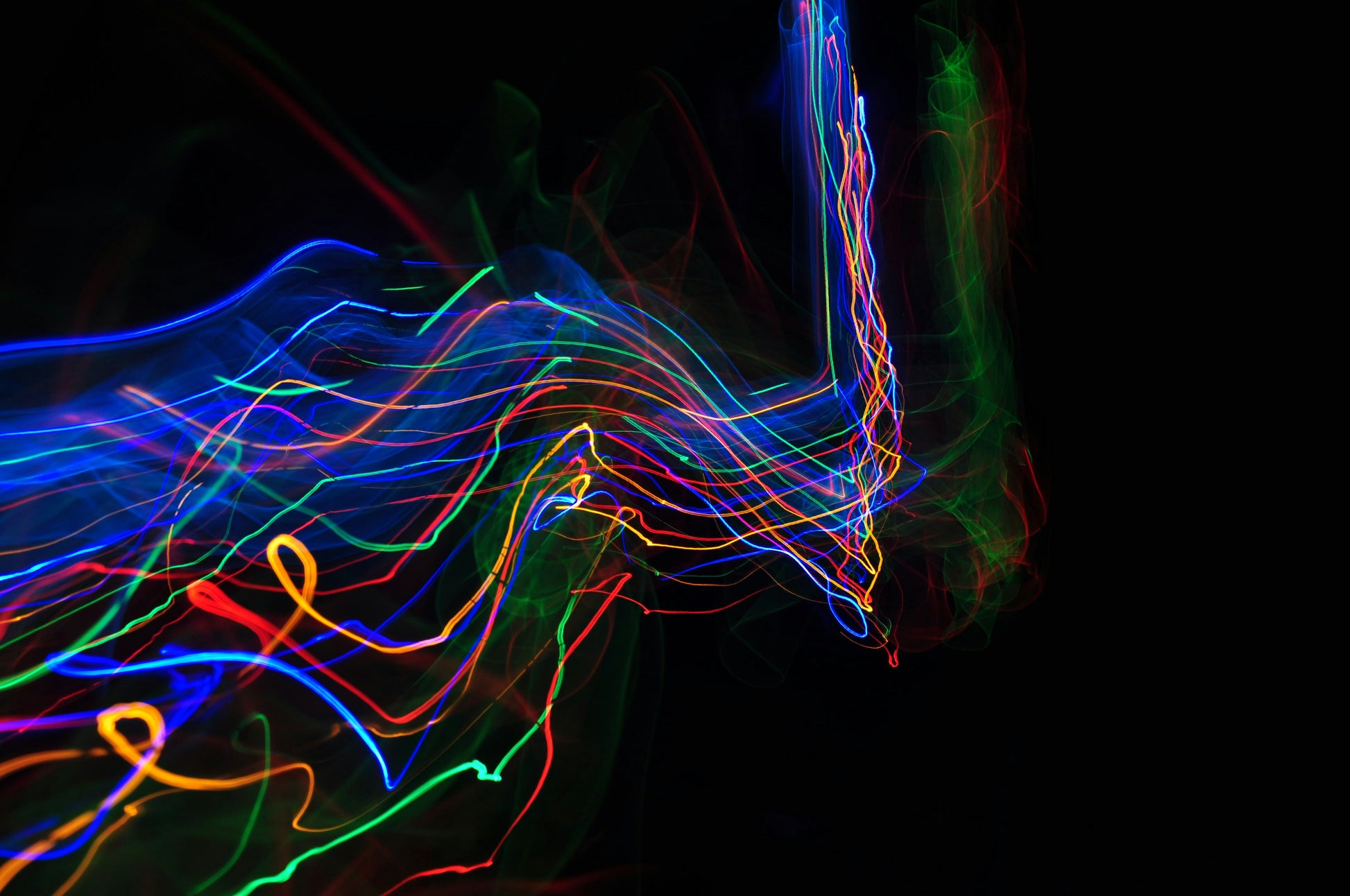 Poster: a blurry photo of a horse with a black background – Adam Barclay (Unsplash)