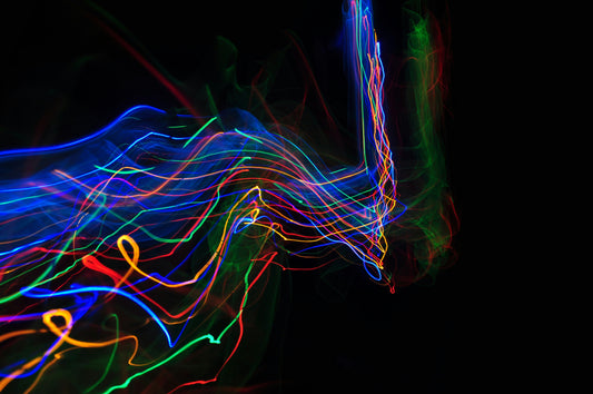 Poster: a blurry photo of a horse with a black background – Adam Barclay (Unsplash)