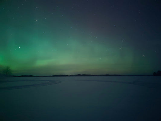 Stretched Canvas: a green and blue aurora bore in the sky – Daniil Skatov (Unsplash)