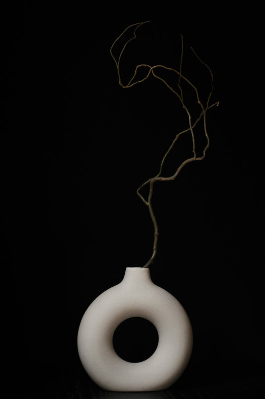 Poster: a light bulb with a string of light coming out of it – J M (Unsplash)